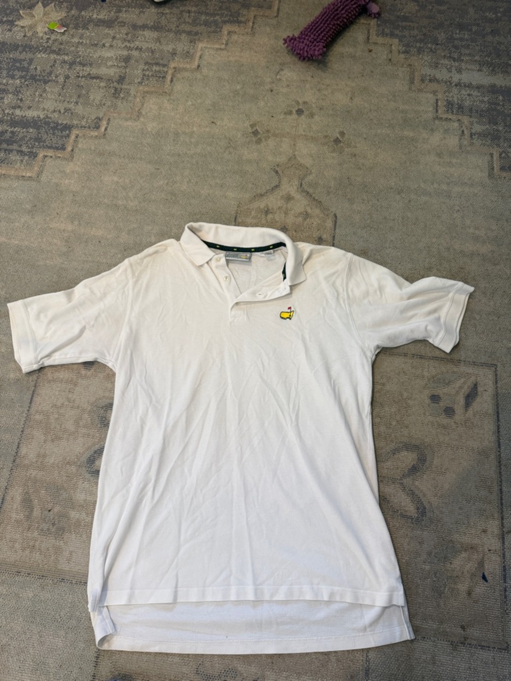 Master’s White Polo with Small Yellow Embroidered Logo
